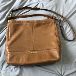 Brown leather coach purse.